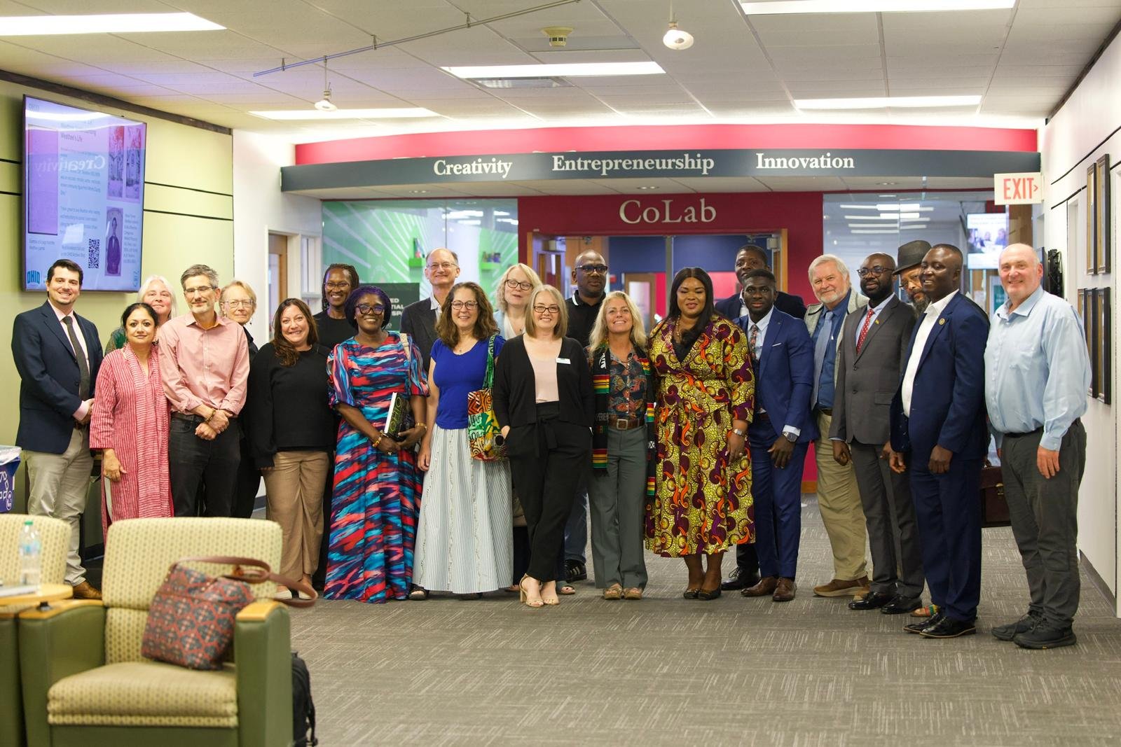 A large group photo of delegates and Ohio University staff at the CoLab
